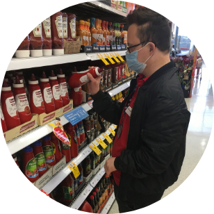 Participant stacking shelves at Coles Supermarket